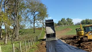 Dump Truck Back Spreading Gravel