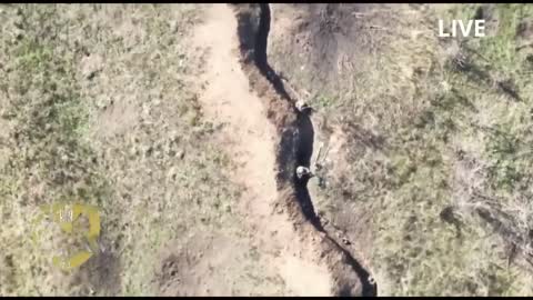 Ukrainian quadcopter drone dropping grenades on Russian trenches