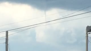 Small tornado on sunny day