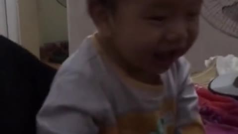 the baby's innocent laugh