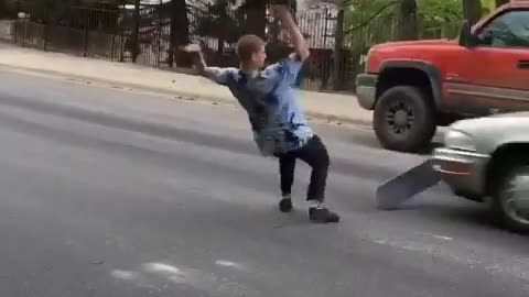 Skater almost gets hit by a car.