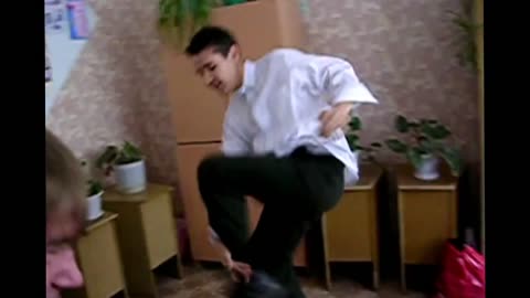 Crazy russian schoolboy dancing in the classroom and breaks furniture