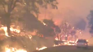 Terrifying video shows California deputy driving through flames after evacuating residents