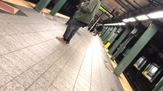 Headphones guy dancing in subway terminal