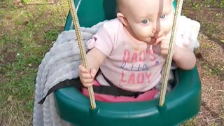 Sweet baby on swing