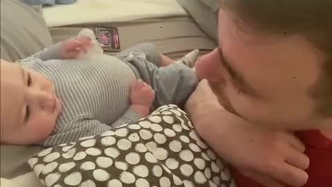 dady takes care of the baby in funny way