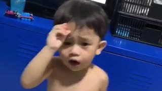 Little boy bangs his head while dancing