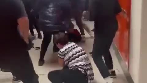 Teachers gets dragged into a school brawl.