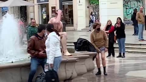 Man Slips After Fountain Dip