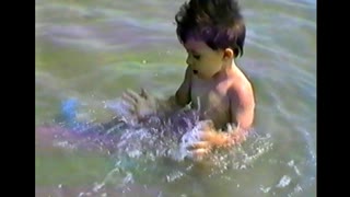 Toddler enjoys fun in the sea