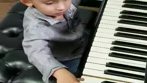 1 year old playing the piano for the first time