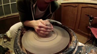 Emily throwing pottery