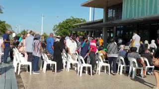 Elderly and health workers follow vaccination queue