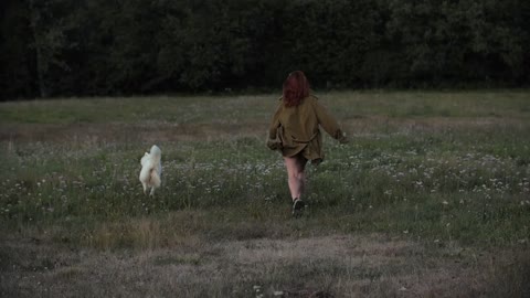 Woman Playing with Her Dog