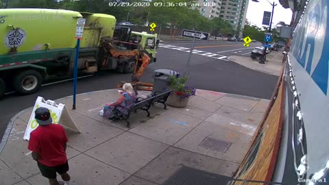 Woman Thrown To The Ground After Garbage Truck Hits Bench