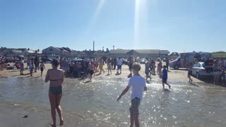 Crowd Saves Car From the Sea