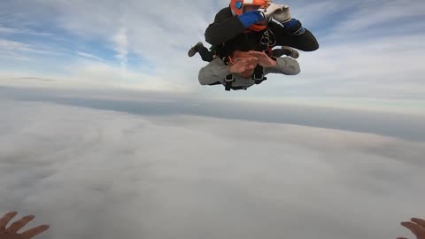 Skydiving through clouds
