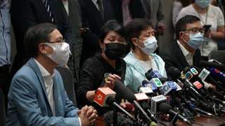 Hong Kong's pro-democracy lawmakers take part in a mass resignation
