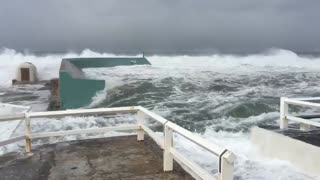 Huge Swells Cover Entire Beachside Pool