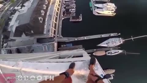 Watch Crazy Daredevil Jump Off 8 Story Building, Nearly Gets Killed