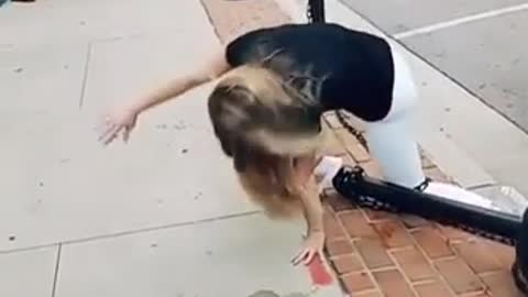 Girl falls but gets up quickly
