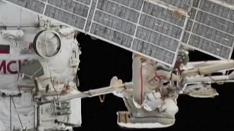 Cosmonauts perform a spacewalk outside the International Space Station