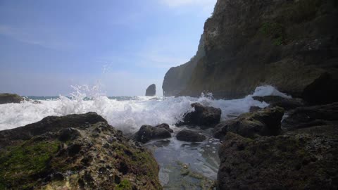 Waves Crashing Over Rocks