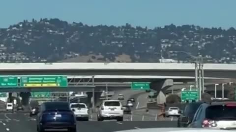 Naked negro female shoots at cars on San Fran freeway!