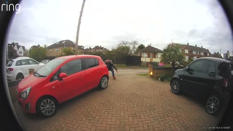 Guy and His Daughter Chasing Dog Around Car Then Girl Manages To Catch Him