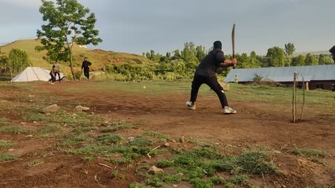 Villagers playing cricket in beautiful placeVillagers playing cricket in beautiful place