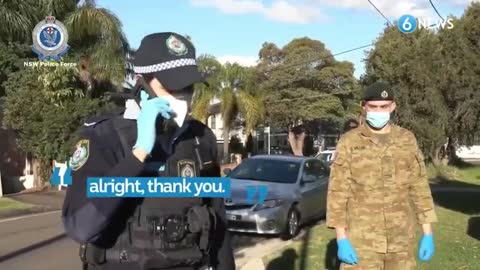 AUSTRALIA ENFORCING THE COVID LOCKDOWN IN SYDNEY. SOLDIERS GO DOOR TO DOOR. HELICOPTERS FLY ABOVE.