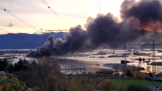 Massive parking lot blaze erupts amid Canada floods