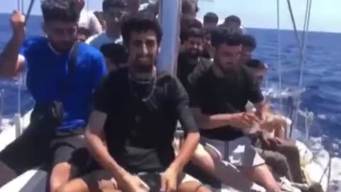 Boatload of male 'refugees' openly destroy their passports and documents en-route to Italy..