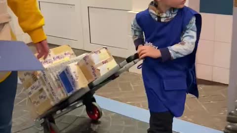 A little boy works as a courier