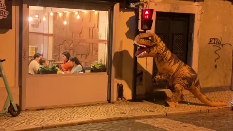 Man in T-Rex Costume Scares Girl in Restaurant