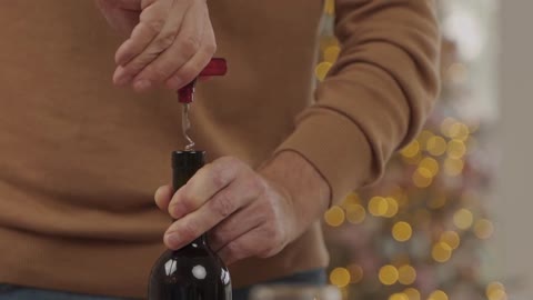 Uncorking A Bottle Of Wine For A Toast