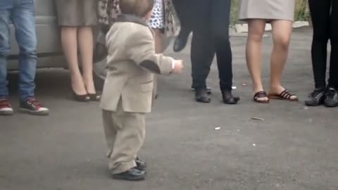 Little boy dances to traditional music
