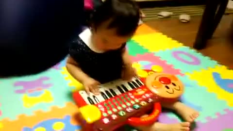 cute girl taking piano