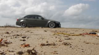 Car Owner At Beach Going To His Fast Car