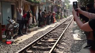 Train Passes Through Tiny Street in Vietnam