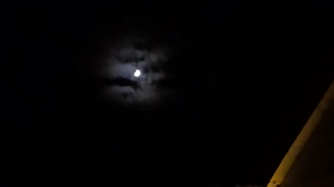 Freaky! The moon has clouds behind it?