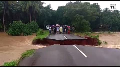 Kerala road cave-in as flood water rushes in