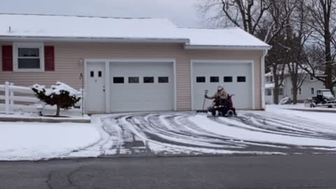 Man in Wheelchair Impressively Clears Driveway of Snow