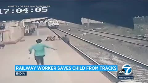 Surveillance video shows moment railroad worker rescues child from oncoming train