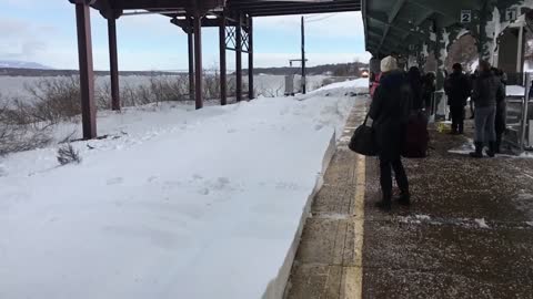 Onlookers Surprised When Train Plows Into Snow