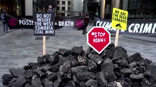 Climate activists dump fake coal at Lloyd's of London