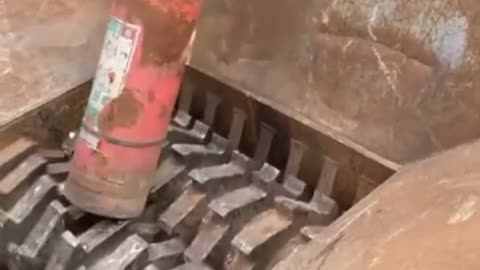Powerful Crushing Machine Crushing a Fire Extinguisher