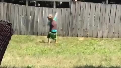 A fence won't stop this kid from playing with his new friend