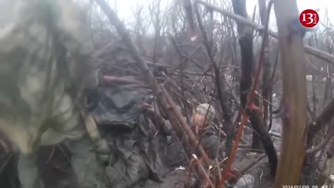 Russian soldiers who survived the battle show their destroyed position and military equipment