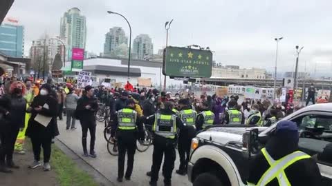 Counter protestors are blocking the road, preventing convoy from entering Downtown Vancouver.